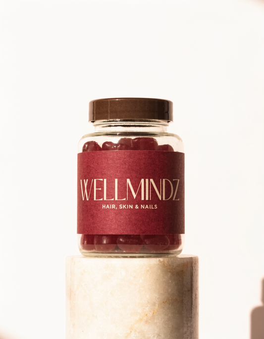 WELLMINDZ Hair, Skin & Nails glass jar with burgundy label and red gummies